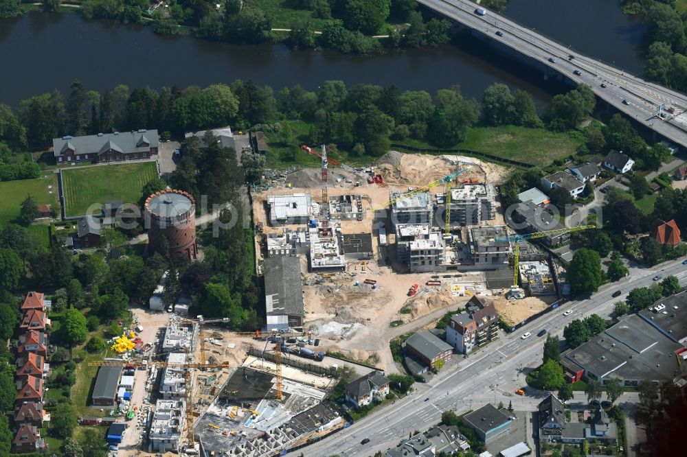 Lübeck from the bird's eye view: Construction site to build a new multi-family residential complex on Ratzeburger Allee - Zum Wasserspeicher in Luebeck in the state Schleswig-Holstein, Germany