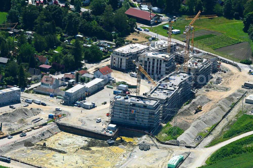 München from the bird's eye view: Construction site to build a new multi-family residential complex mein raum on Lochhausener Strasse - Osterangerstasse in the district Lochhausen in Munich in the state Bavaria, Germany