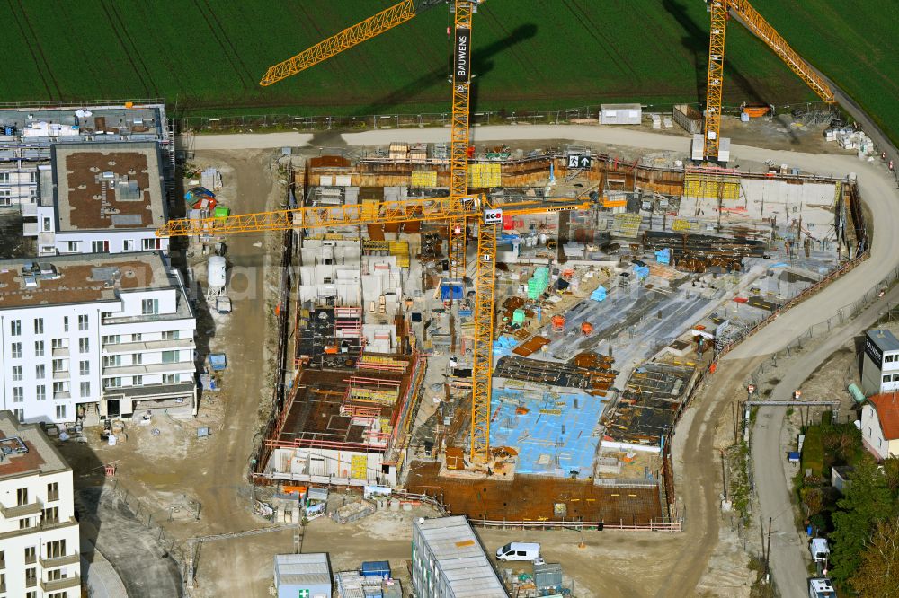 München from the bird's eye view: Construction site to build a new multi-family residential complex mein raum on Lochhausener Strasse - Osterangerstasse in the district Lochhausen in Munich in the state Bavaria, Germany