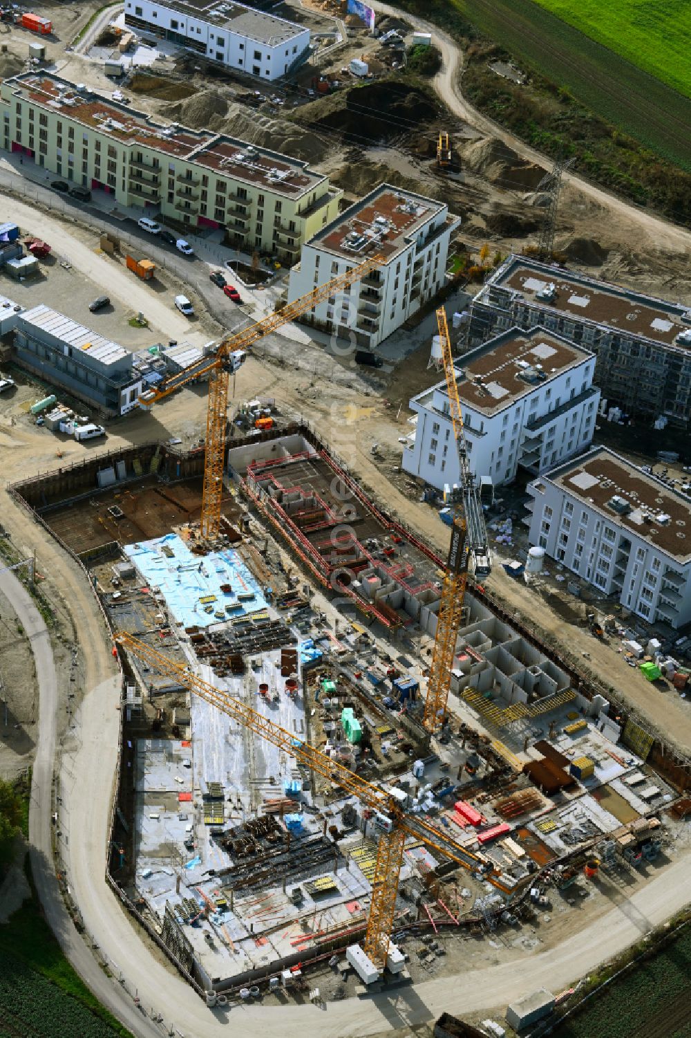 München from the bird's eye view: Construction site to build a new multi-family residential complex mein raum on Lochhausener Strasse - Osterangerstasse in the district Lochhausen in Munich in the state Bavaria, Germany