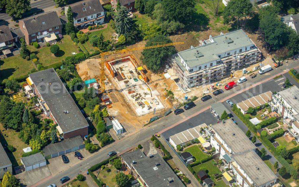 Eppinghoven from the bird's eye view: Construction site to build a new multi-family residential complex of Neubauplanungsgesellschaft von Salm-Hoogstraeten mbH on Joseph-von-Eichendorff-Strasse in Eppinghoven in the state North Rhine-Westphalia, Germany