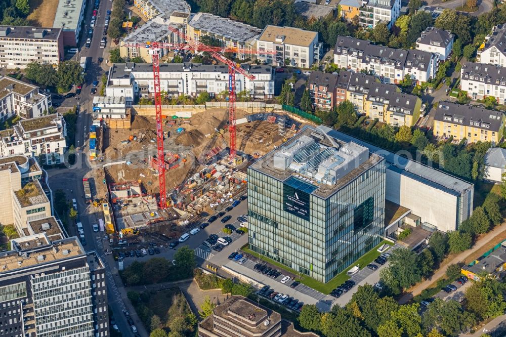 Düsseldorf from the bird's eye view: Construction site to build a new multi-family residential complex Niederkasseler Lohweg 20 in the district Loerick in Duesseldorf in the state North Rhine-Westphalia, Germany