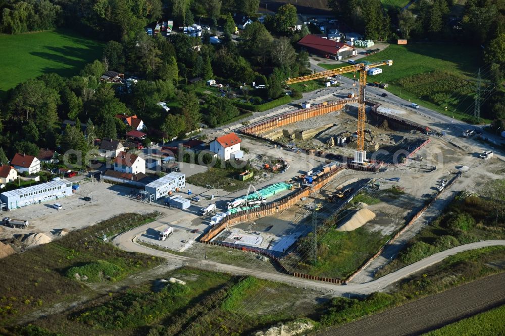 München from the bird's eye view: Construction site to build a new multi-family residential complex in the district Aubing-Lochhausen in Munich in the state Bavaria, Germany