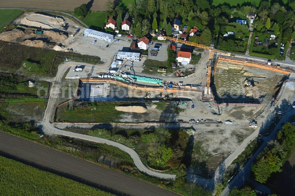 München from the bird's eye view: Construction site to build a new multi-family residential complex in the district Aubing-Lochhausen in Munich in the state Bavaria, Germany