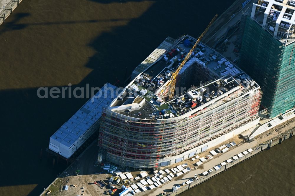 Hamburg from the bird's eye view: Construction site to build a new multi-family residential complex of DC DEVELOPMENTS GMBH & CO. KG on Strandkai along the Nordelbe in the district HafenCity in Hamburg, Germany