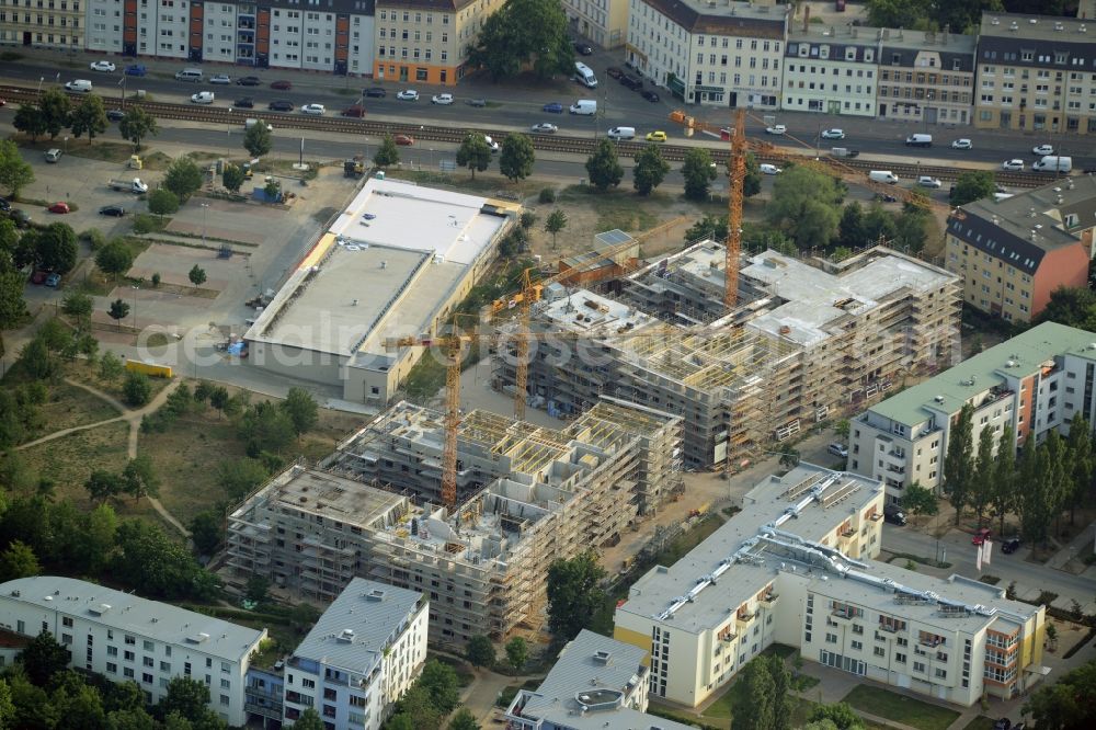 Aerial image Berlin - Construction site to build a new multi-family residential complex in the Koepenick part of the district of Treptow-Koepenick in Berlin in Germany. The complex includes several apartment buildings and is located on Am Amtsgraben street, in the North of Mueggelheimer Strasse. Entworfen wurde das Projekt von Numrich Albrecht Klumpp Gesellschaft von Architekten mbH