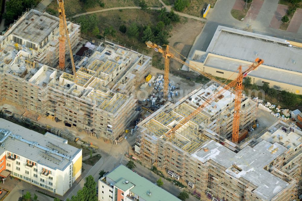 Berlin from the bird's eye view: Construction site to build a new multi-family residential complex in the Koepenick part of the district of Treptow-Koepenick in Berlin in Germany. The complex includes several apartment buildings and is located on Am Amtsgraben street, in the North of Mueggelheimer Strasse. Entworfen wurde das Projekt von Numrich Albrecht Klumpp Gesellschaft von Architekten mbH