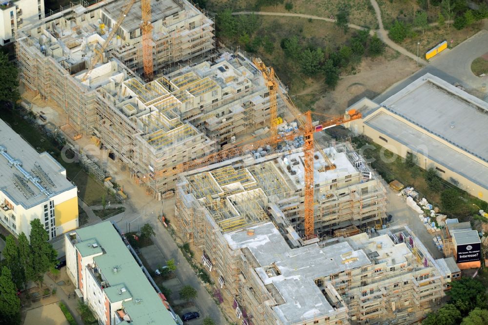 Aerial image Berlin - Construction site to build a new multi-family residential complex in the Koepenick part of the district of Treptow-Koepenick in Berlin in Germany. The complex includes several apartment buildings and is located on Am Amtsgraben street, in the North of Mueggelheimer Strasse. Entworfen wurde das Projekt von Numrich Albrecht Klumpp Gesellschaft von Architekten mbH