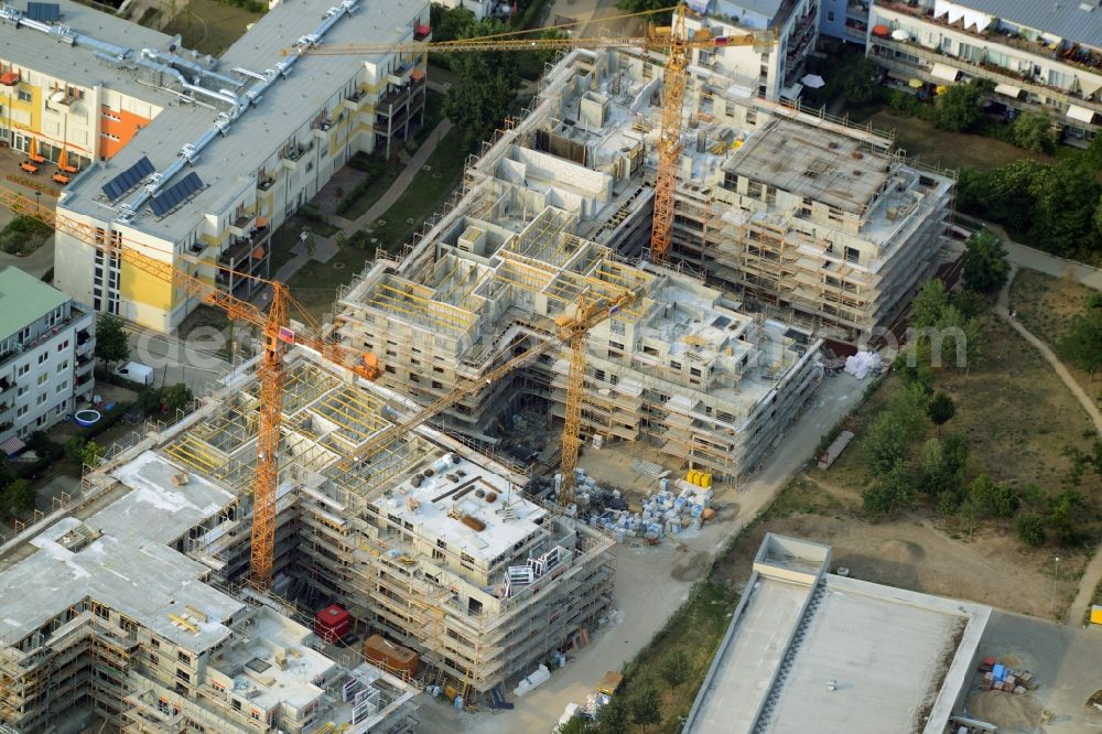 Aerial image Berlin - Construction site to build a new multi-family residential complex in the Koepenick part of the district of Treptow-Koepenick in Berlin in Germany. The complex includes several apartment buildings and is located on Am Amtsgraben street, in the North of Mueggelheimer Strasse. Entworfen wurde das Projekt von Numrich Albrecht Klumpp Gesellschaft von Architekten mbH