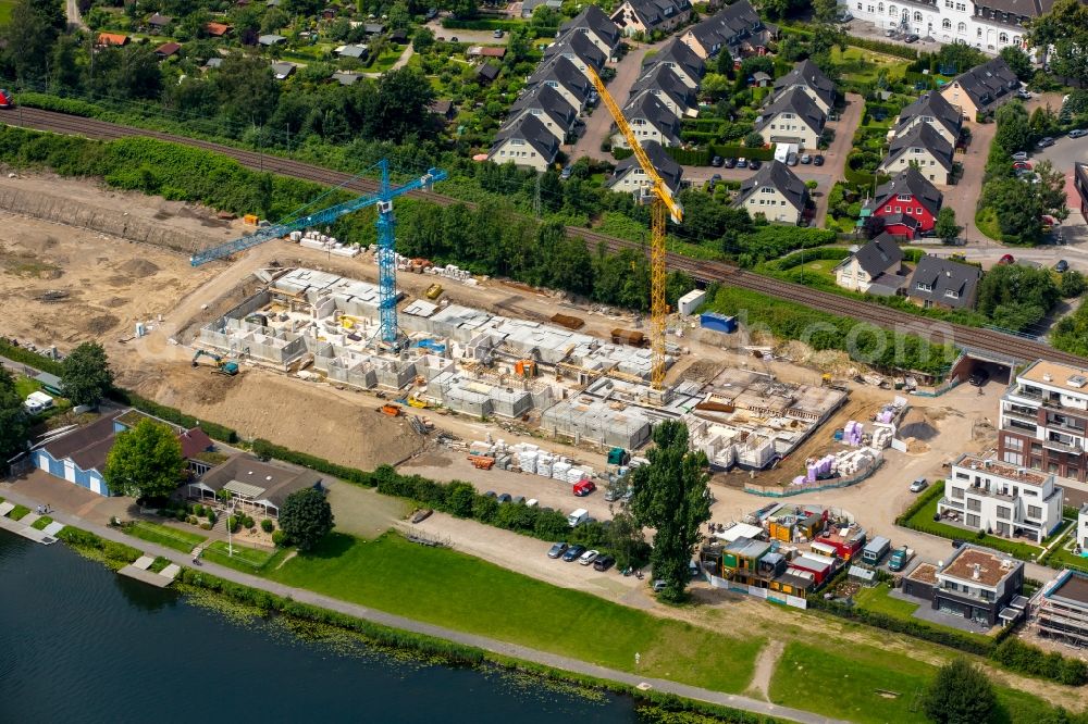 Essen from the bird's eye view: Construction site to build a new multi-family residential complex Promenadenweg on river banks of Ruhr in the district Kettwig in Essen in the state North Rhine-Westphalia