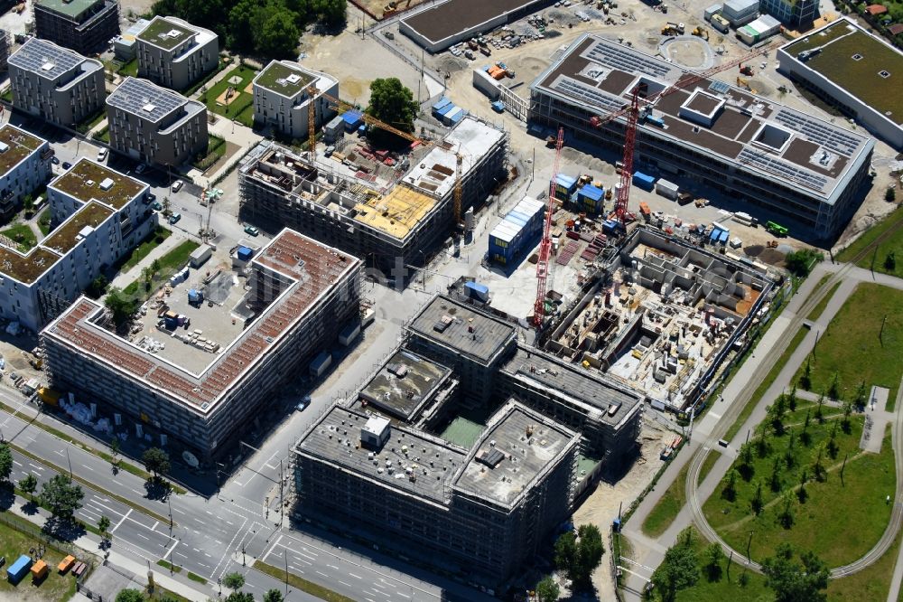 München from the bird's eye view: Construction site to build a new multi-family residential complex Quarter City II on Quarter City II - Bauhausplatz in Domagkpark in the district Schwabing-Freimann in Munich in the state Bavaria, Germany