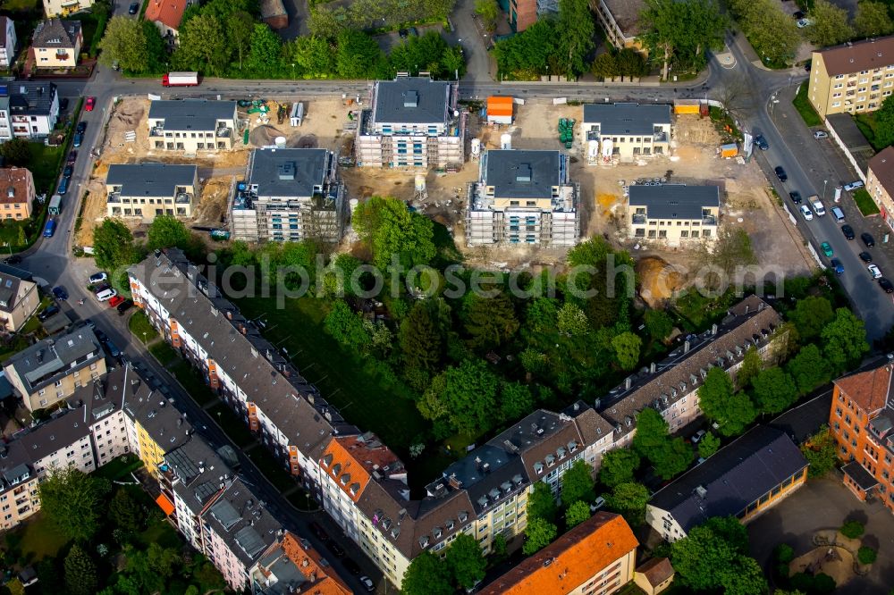 Aerial photograph Hagen - Construction site of a new multi-family residential estate opposite Hildegardis School in the Ischeland part of Hagen in the state of North Rhine-Westphalia