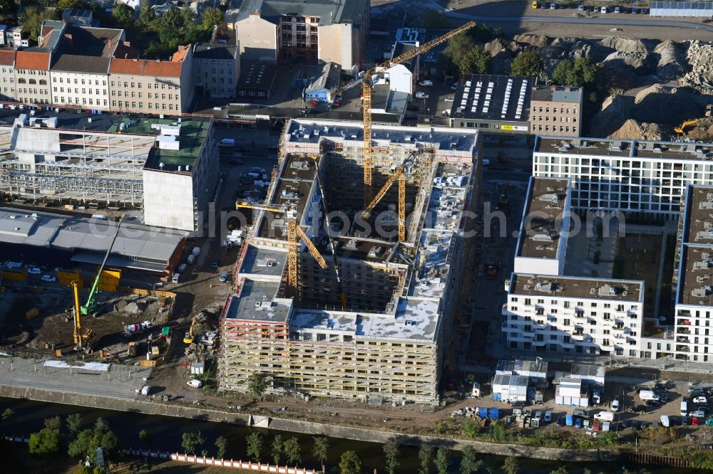 Berlin from the bird's eye view: Construction site to build a new multi-family residential complex of Richard Ditting GmbH & Co. KG on Heidestrasse in Berlin, Germany