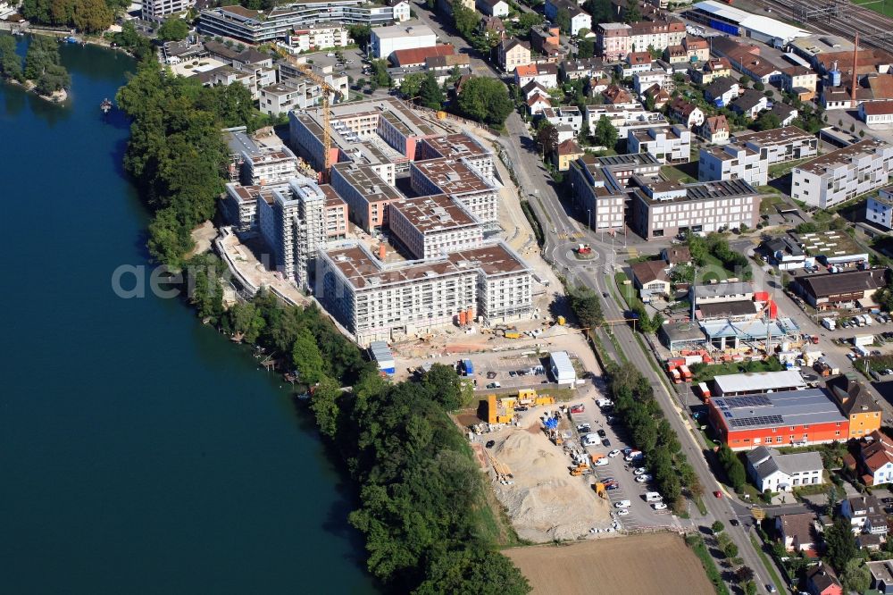 Rheinfelden from the bird's eye view: Construction site for building a new multi-family residential complex Salmen Park on a former brewery site in Rheinfelden in Switzerland at the river Rhine