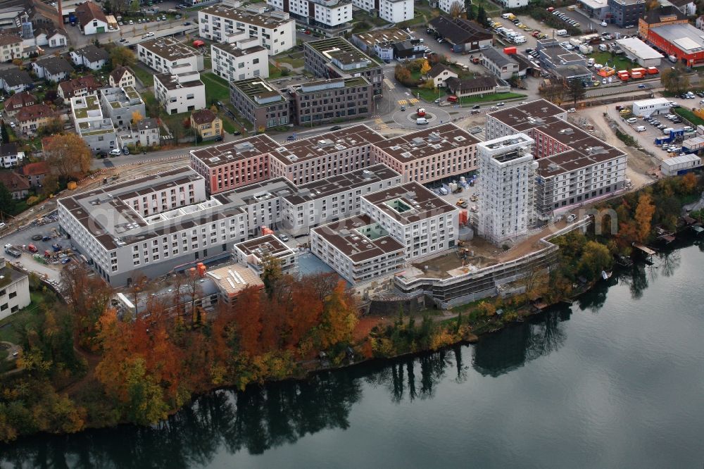 Rheinfelden from above - Construction site for building a new multi-family residential complex Salmen Park on a former brewery site in Rheinfelden in Switzerland at the river Rhine