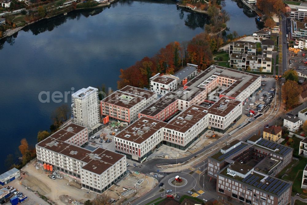 Rheinfelden from the bird's eye view: Construction site for building a new multi-family residential complex Salmen Park on a former brewery site in Rheinfelden in Switzerland at the river Rhine