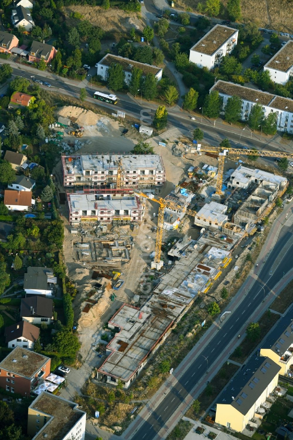 Berlin from the bird's eye view: Construction site to build a new multi-family residential complex Schoenefelder Chaussee corner Wegedornstrasse in the district Altglienicke in Berlin, Germany