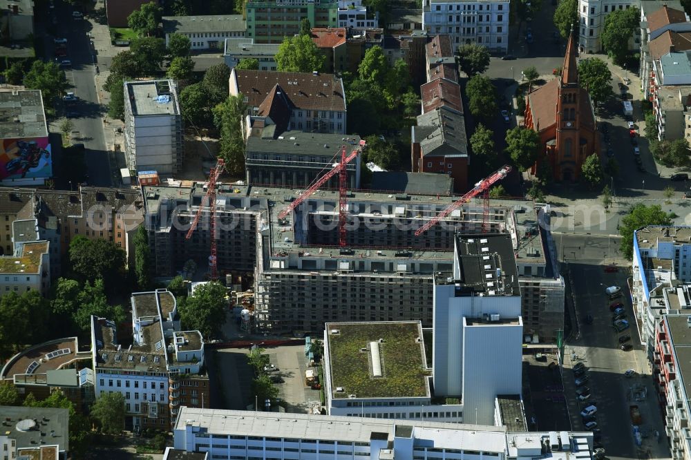 Berlin from above - Construction site to build a new multi-family residential complex on Kurfuerstenstrasse corner Genthiner Strasse in Berlin, Germany