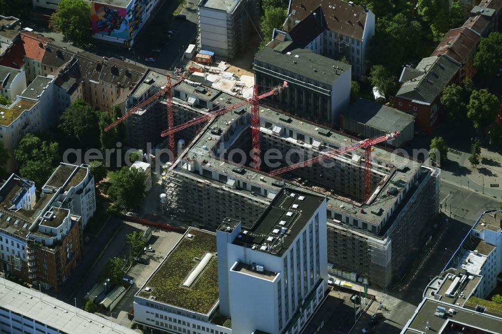 Berlin from the bird's eye view: Construction site to build a new multi-family residential complex on Kurfuerstenstrasse corner Genthiner Strasse in Berlin, Germany