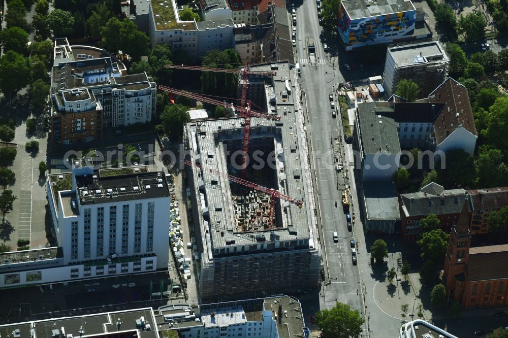 Berlin from above - Construction site to build a new multi-family residential complex on Kurfuerstenstrasse corner Genthiner Strasse in Berlin, Germany