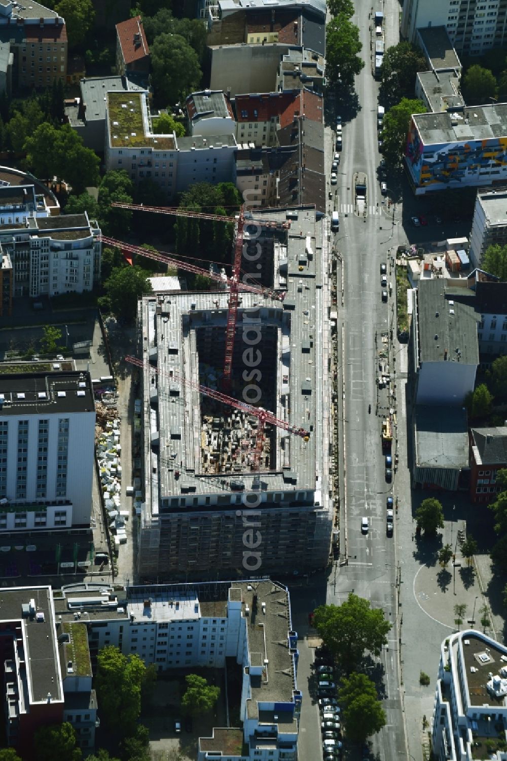 Berlin from the bird's eye view: Construction site to build a new multi-family residential complex on Kurfuerstenstrasse corner Genthiner Strasse in Berlin, Germany