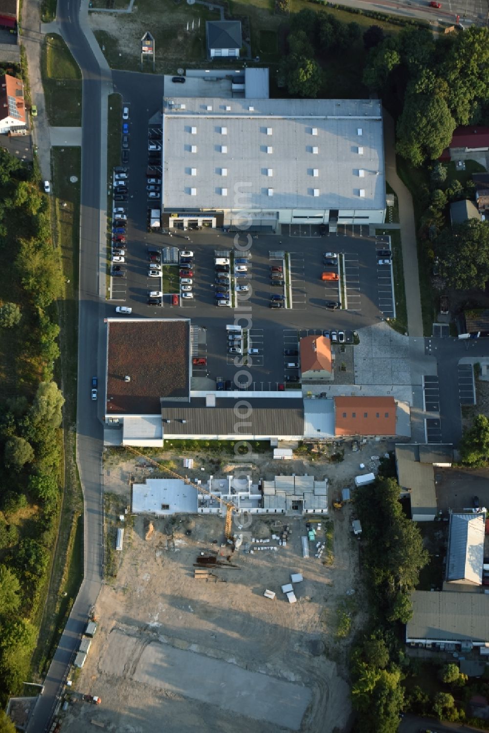 Berlin from the bird's eye view: Construction site to build a new multi-family residential complex An der Schule destrict Mahlsdorf in Berlin