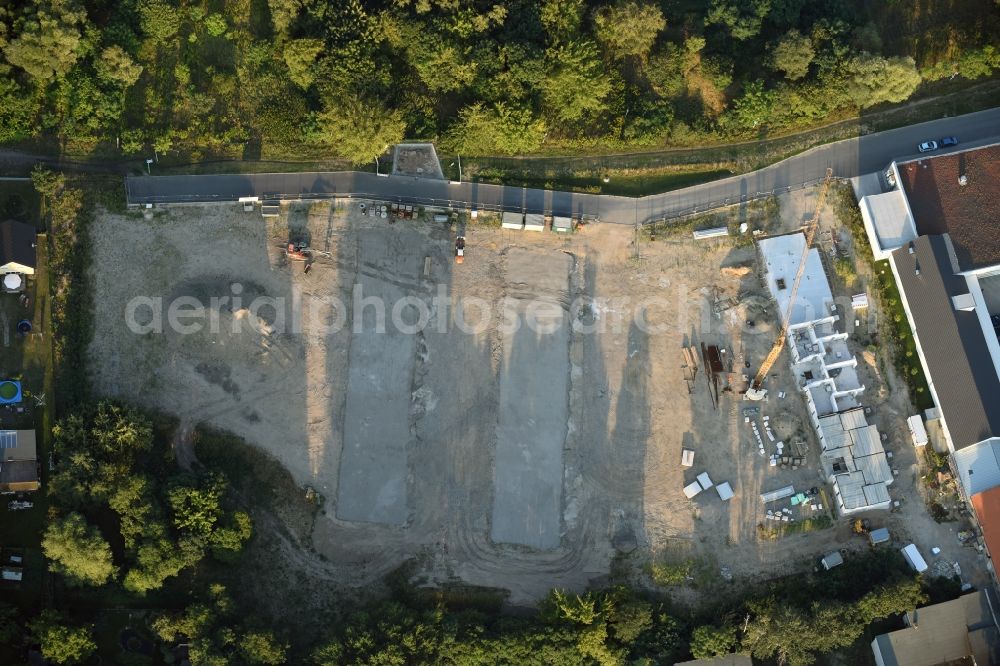 Berlin from the bird's eye view: Construction site to build a new multi-family residential complex An der Schule destrict Mahlsdorf in Berlin