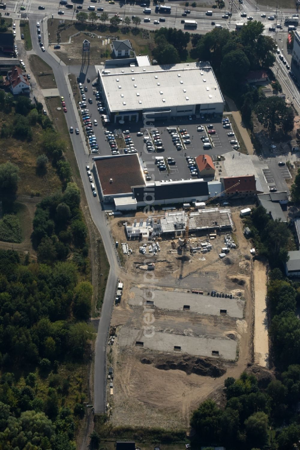 Berlin from the bird's eye view: Construction site to build a new multi-family residential complex An der Schule destrict Mahlsdorf in Berlin