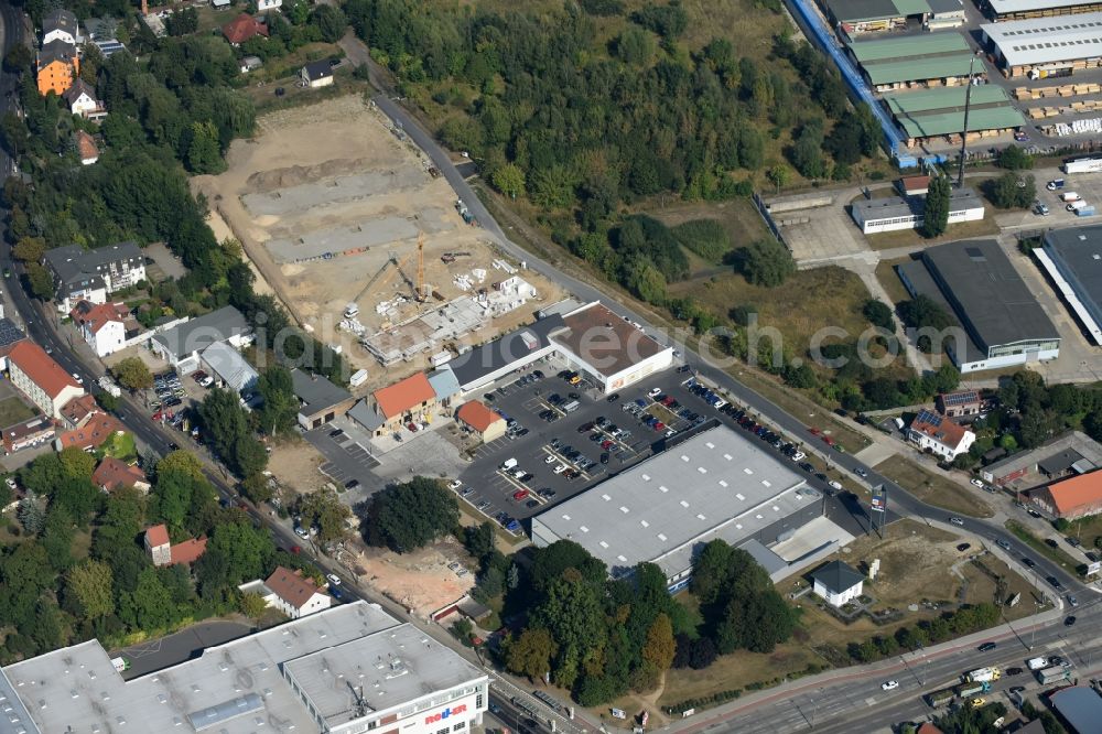 Berlin from the bird's eye view: Construction site to build a new multi-family residential complex An der Schule destrict Mahlsdorf in Berlin