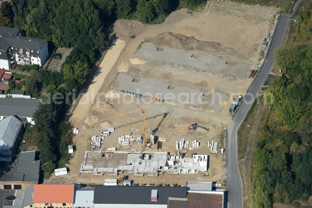 Berlin from the bird's eye view: Construction site to build a new multi-family residential complex An der Schule destrict Mahlsdorf in Berlin