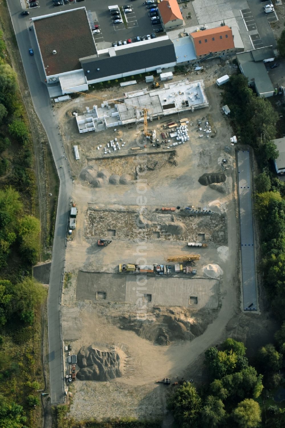 Berlin from the bird's eye view: Construction site to build a new multi-family residential complex An der Schule destrict Mahlsdorf in Berlin