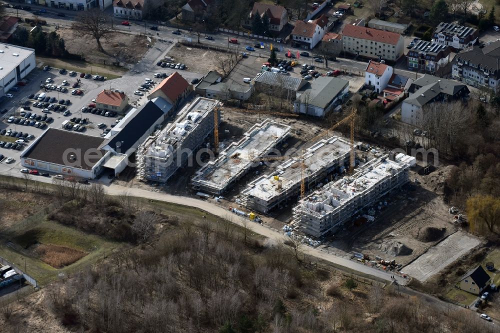 Berlin from the bird's eye view: Construction site to build a new multi-family residential complex An der Schule destrict Mahlsdorf in Berlin