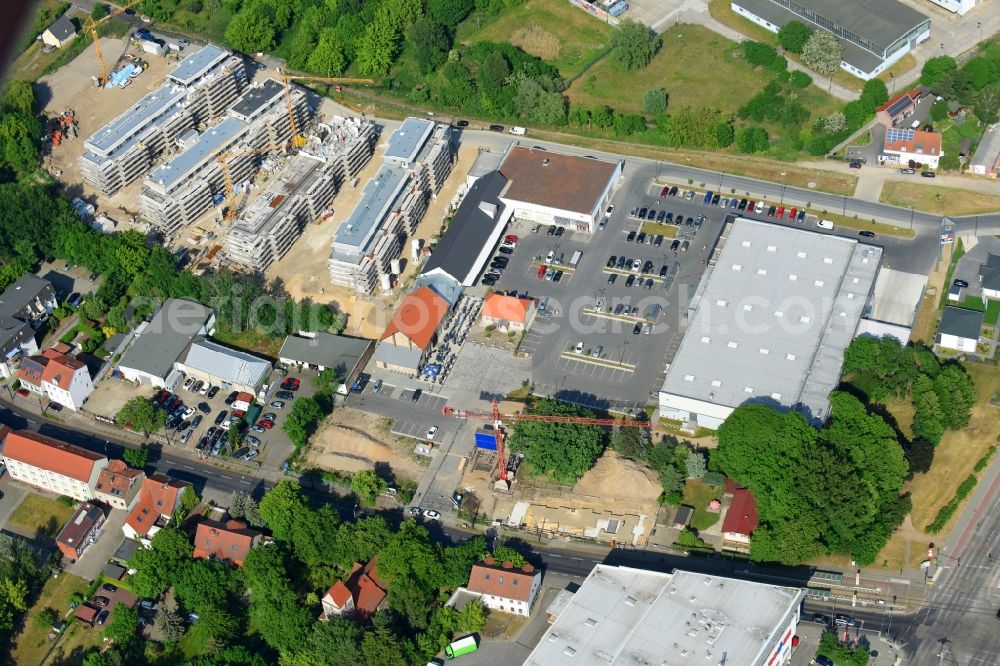 Berlin from the bird's eye view: Construction site to build a new multi-family residential complex An der Schule destrict Mahlsdorf in Berlin