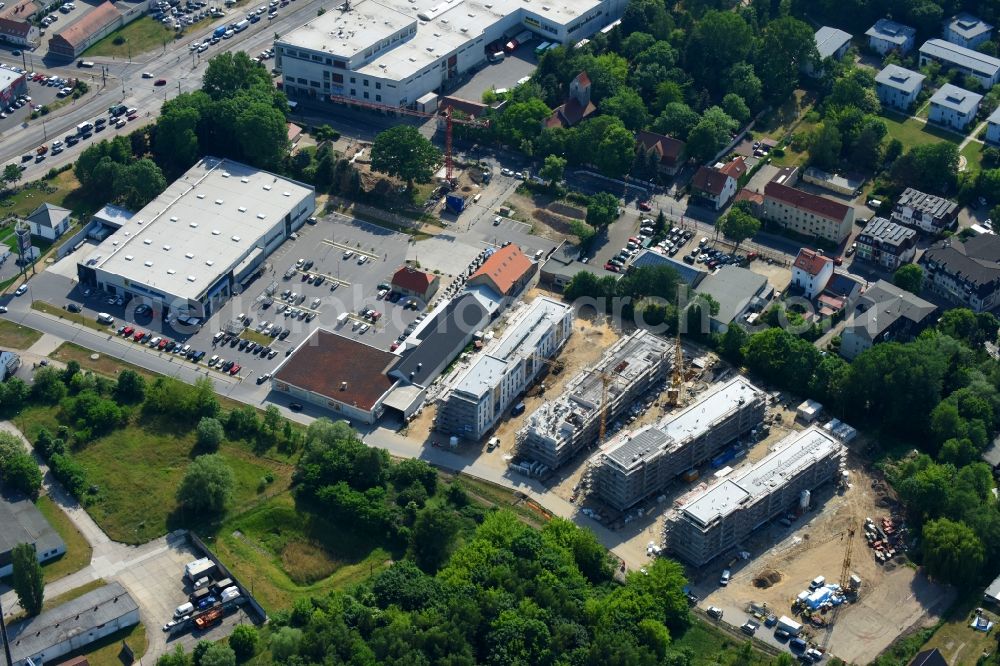 Berlin from the bird's eye view: Construction site to build a new multi-family residential complex An der Schule destrict Mahlsdorf in Berlin