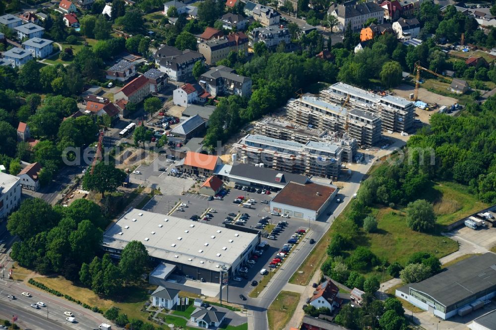 Berlin from the bird's eye view: Construction site to build a new multi-family residential complex An der Schule destrict Mahlsdorf in Berlin