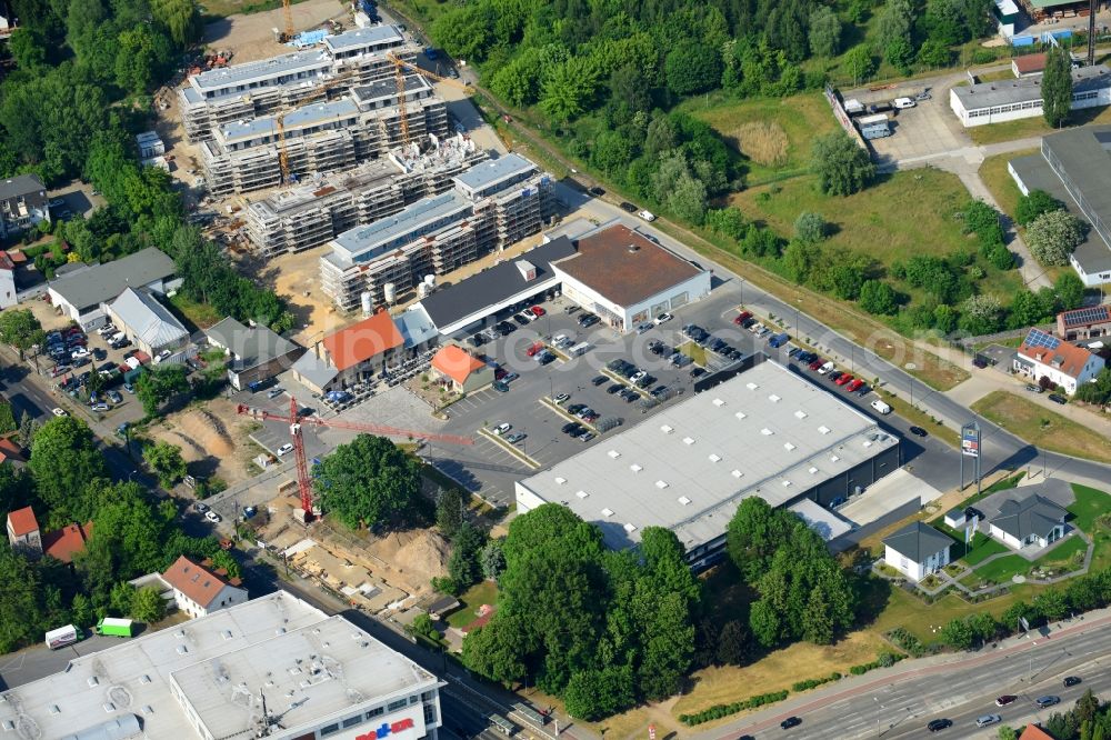 Berlin from the bird's eye view: Construction site to build a new multi-family residential complex An der Schule destrict Mahlsdorf in Berlin