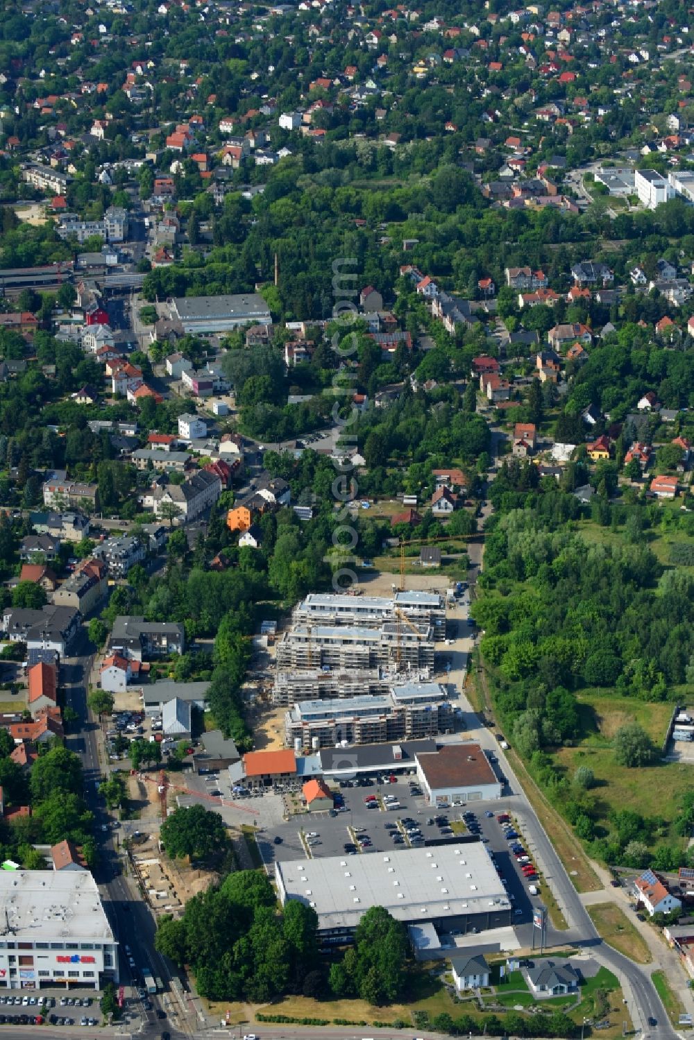 Berlin from the bird's eye view: Construction site to build a new multi-family residential complex An der Schule destrict Mahlsdorf in Berlin