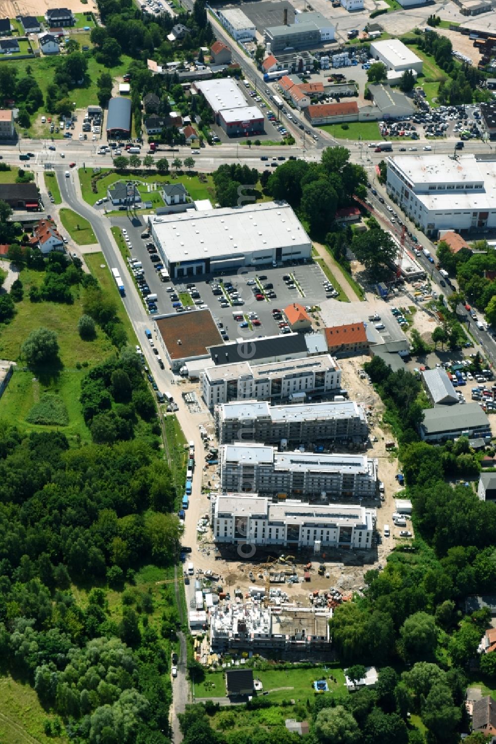 Berlin from the bird's eye view: Construction site to build a new multi-family residential complex An der Schule destrict Mahlsdorf in Berlin