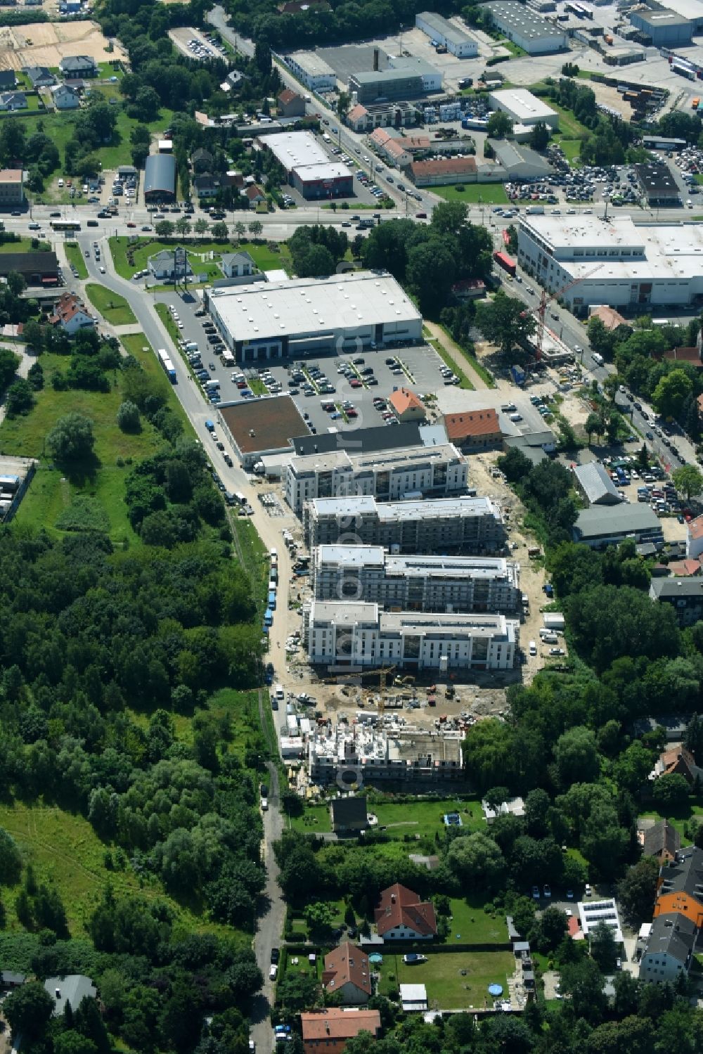 Berlin from the bird's eye view: Construction site to build a new multi-family residential complex An der Schule destrict Mahlsdorf in Berlin