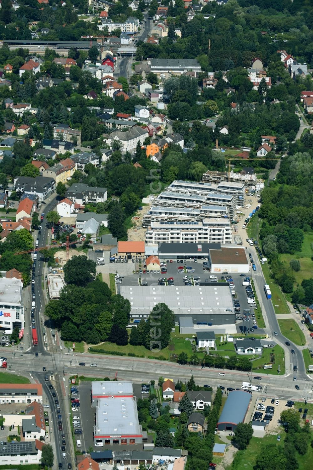 Berlin from the bird's eye view: Construction site to build a new multi-family residential complex An der Schule destrict Mahlsdorf in Berlin