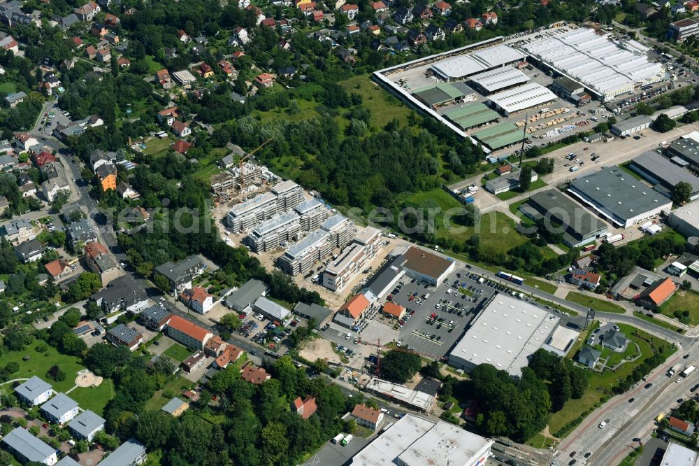 Berlin from the bird's eye view: Construction site to build a new multi-family residential complex An der Schule destrict Mahlsdorf in Berlin