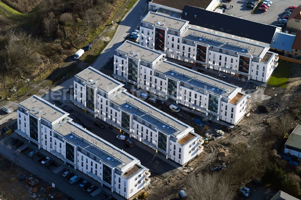 Berlin from the bird's eye view: Construction site to build a new multi-family residential complex An der Schule destrict Mahlsdorf in Berlin