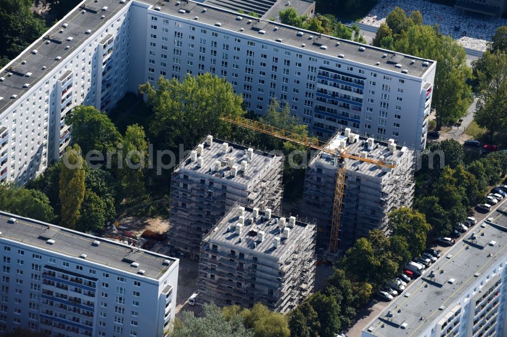 Berlin from the bird's eye view: Construction site to build a new multi-family residential complex townhouses Dolgenseestrasse of housing association HOWOGE in the district Lichtenberg in Berlin, Germany