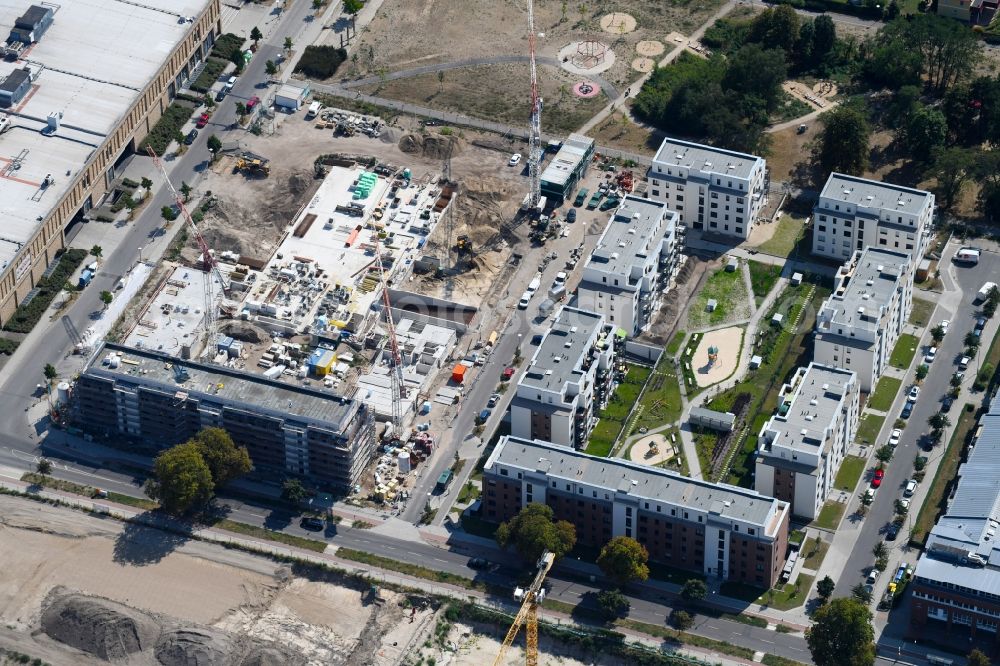 Berlin from the bird's eye view: Construction site to build a new multi-family residential complex of Bonava Deutschland GmbH in of Weissenhoeher Strasse destrict Biedorf in Berlin, Germany