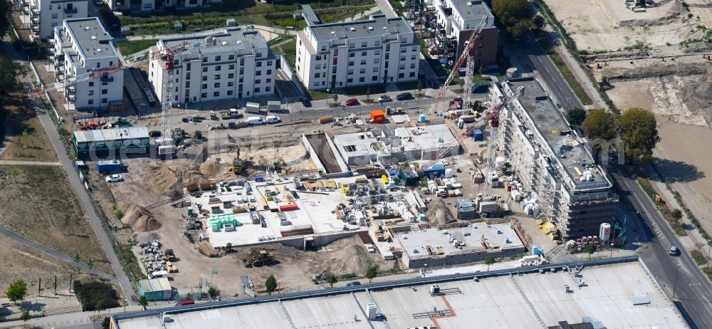 Berlin from the bird's eye view: Construction site to build a new multi-family residential complex of Bonava Deutschland GmbH in of Weissenhoeher Strasse destrict Biedorf in Berlin, Germany