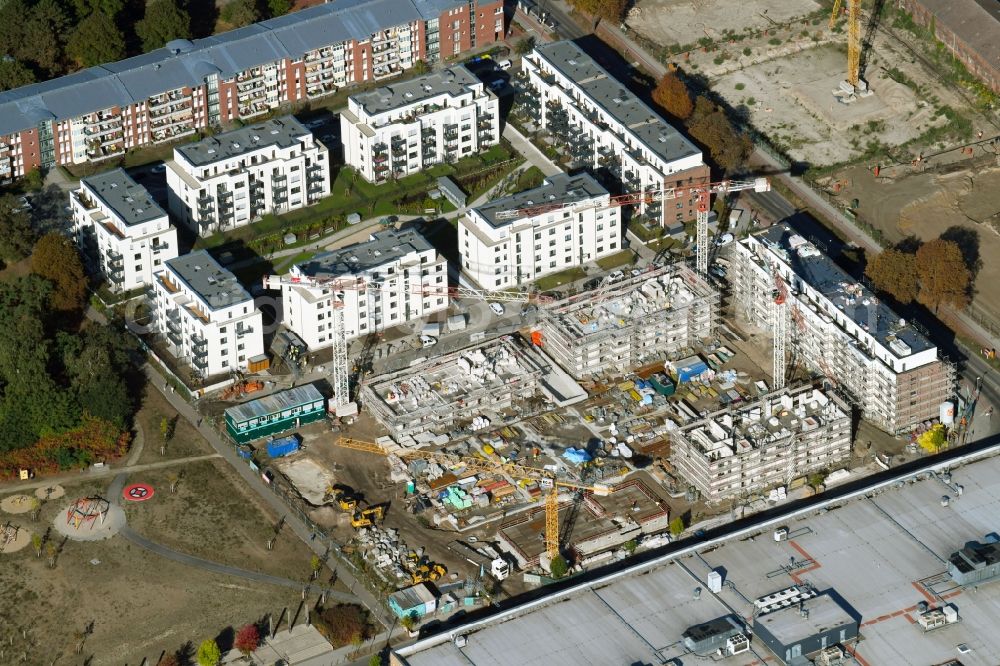 Berlin from the bird's eye view: Construction site to build a new multi-family residential complex of Bonava Deutschland GmbH in of Weissenhoeher Strasse destrict Biedorf in Berlin, Germany