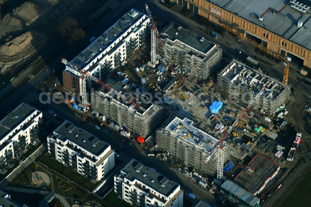 Berlin from the bird's eye view: Construction site to build a new multi-family residential complex of Bonava Deutschland GmbH in of Weissenhoeher Strasse destrict Biedorf in Berlin, Germany