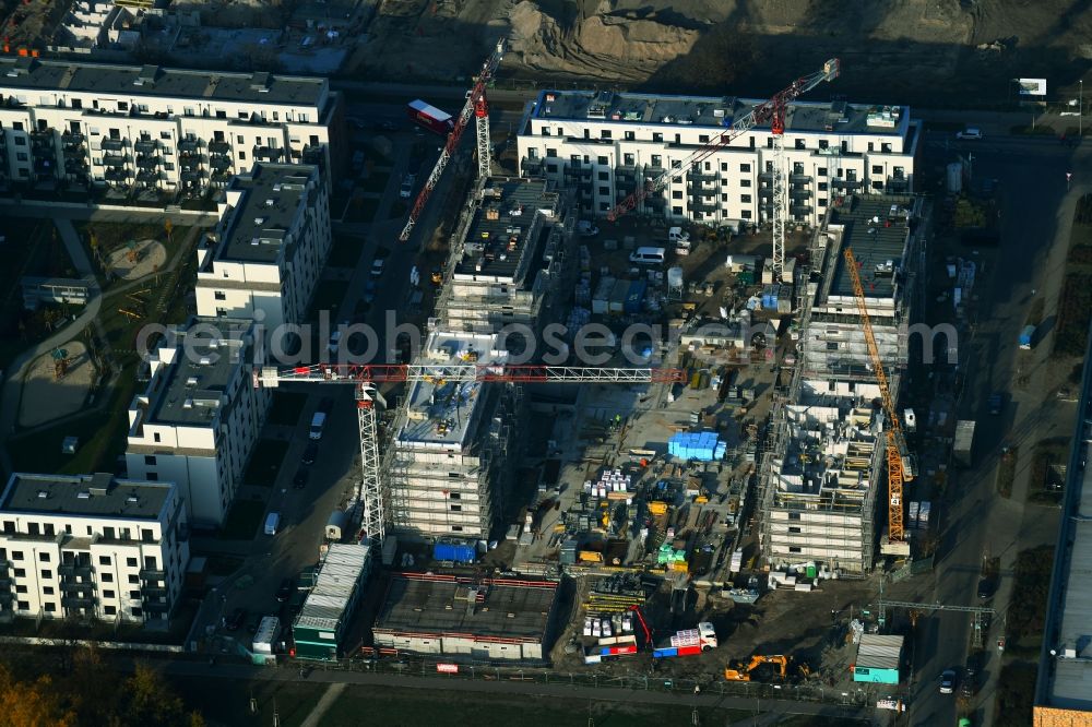 Berlin from the bird's eye view: Construction site to build a new multi-family residential complex of Bonava Deutschland GmbH in of Weissenhoeher Strasse destrict Biedorf in Berlin, Germany