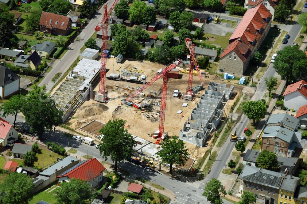 Oranienburg from the bird's eye view: Construction site to build a new multi-family residential complex Strasse of Einheit corner Waldstrasse in Oranienburg in the state Brandenburg, Germany