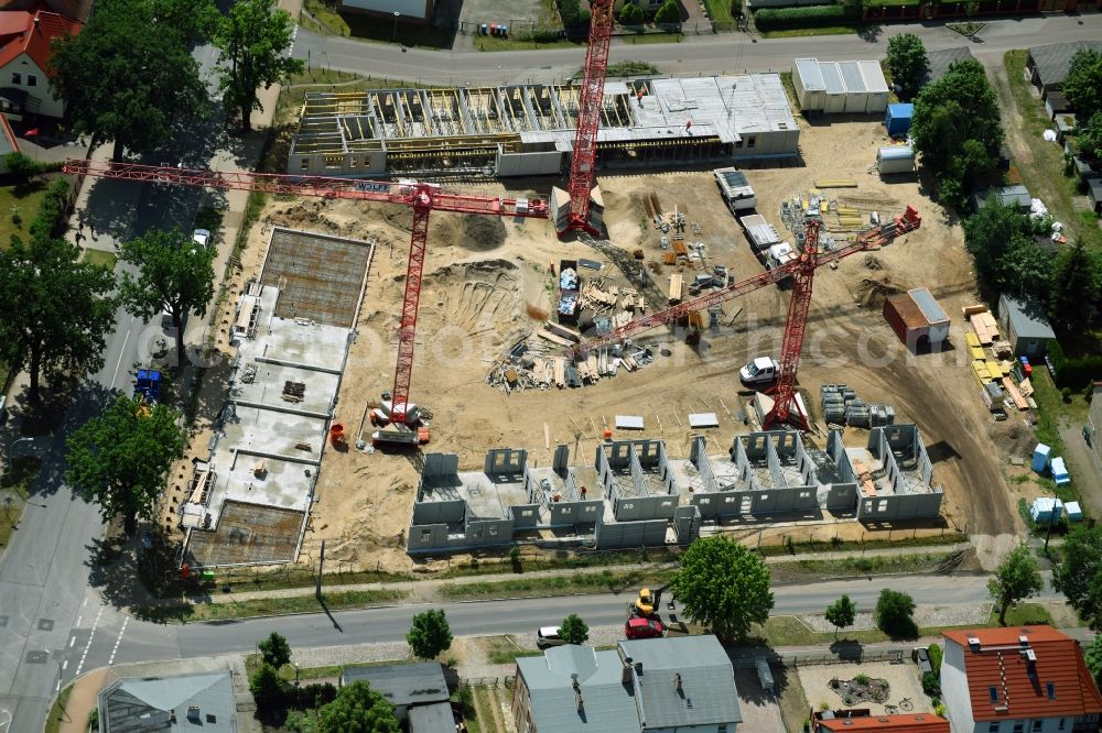 Oranienburg from above - Construction site to build a new multi-family residential complex Strasse of Einheit corner Waldstrasse in Oranienburg in the state Brandenburg, Germany